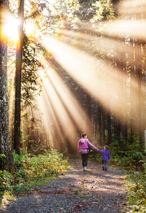 Mom walking in forest with child